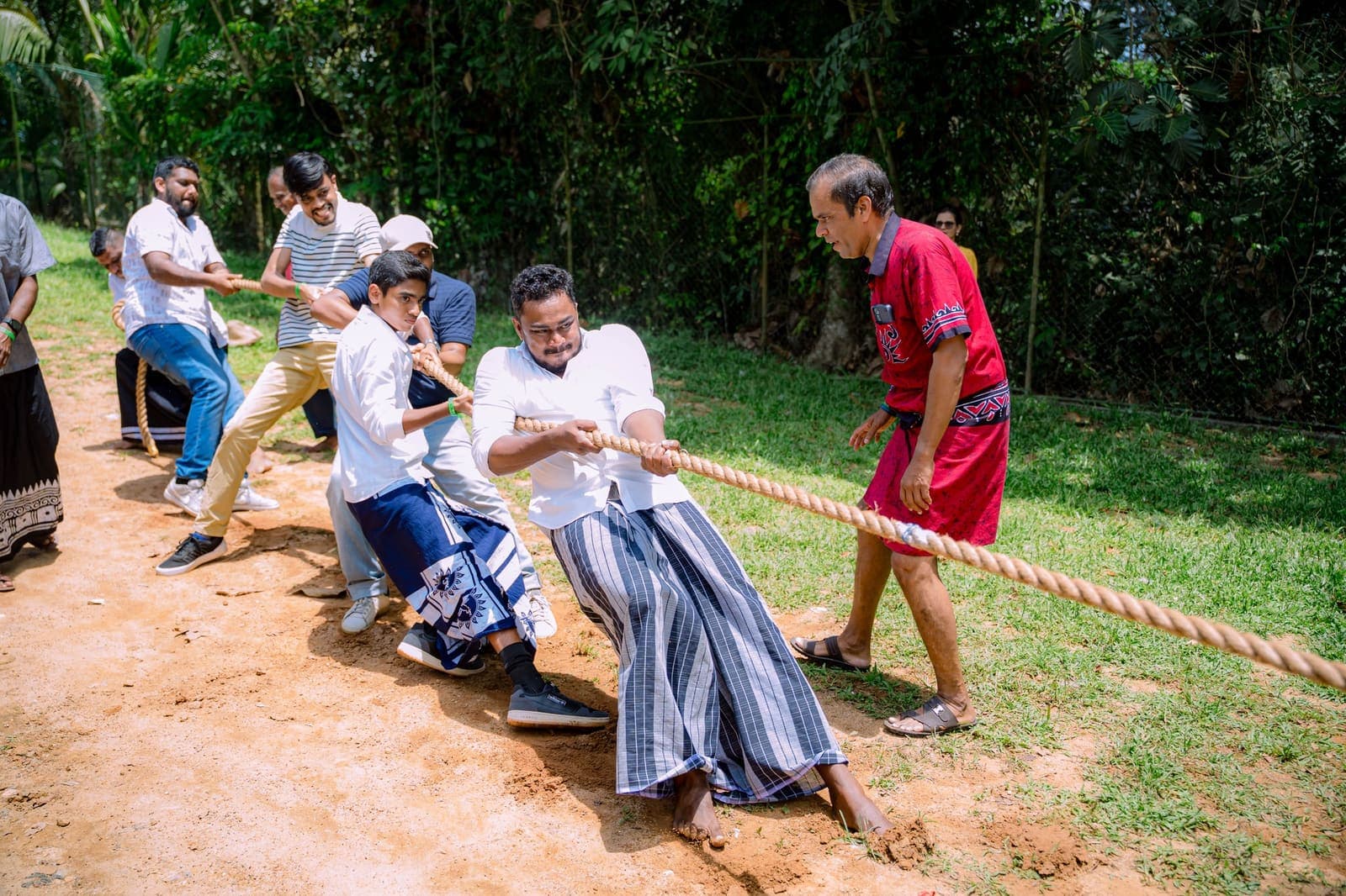 Guests pulling on a rope in a tug of war at the Awurudu day out