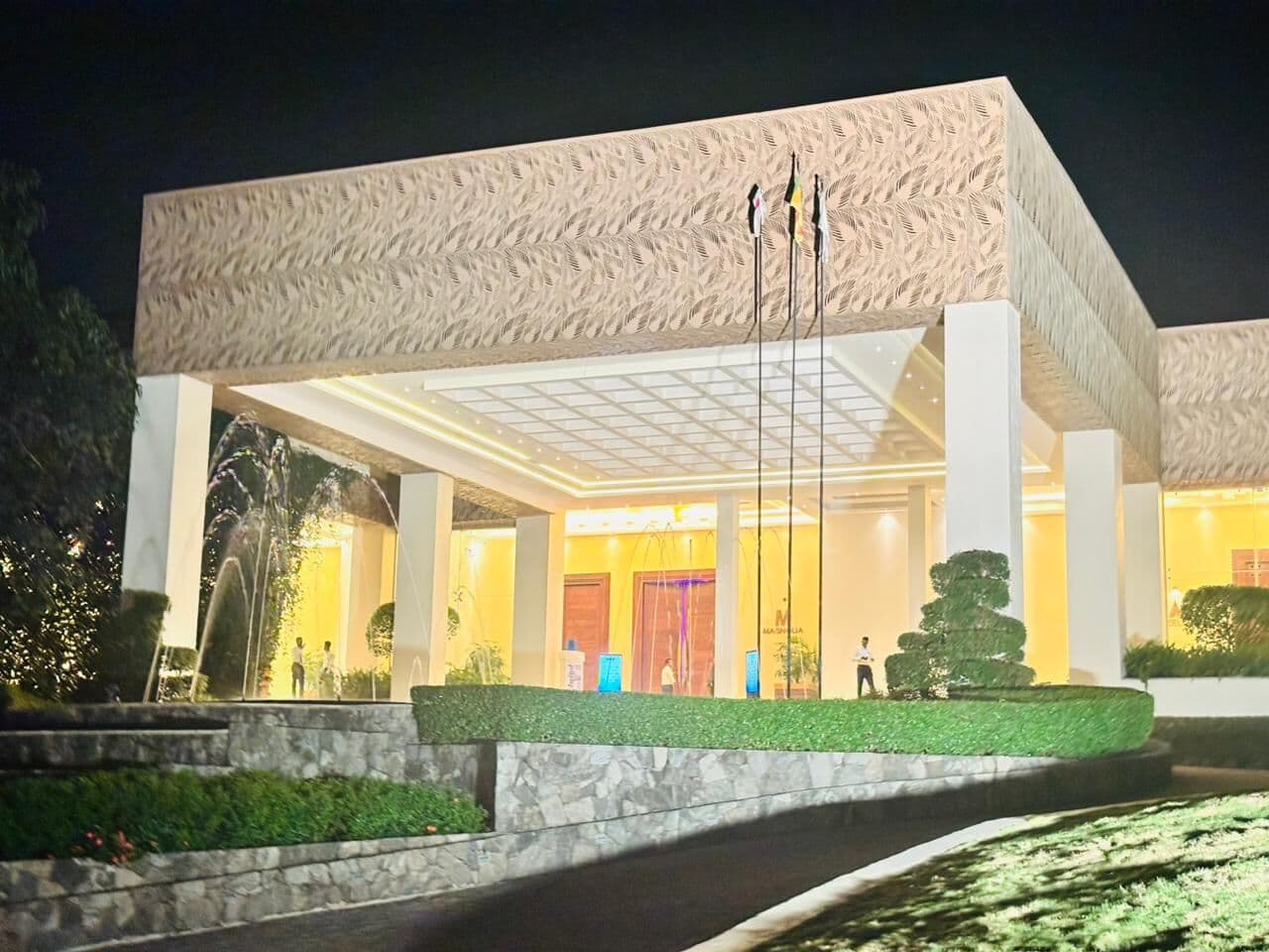 The hotel entrance lit up at night