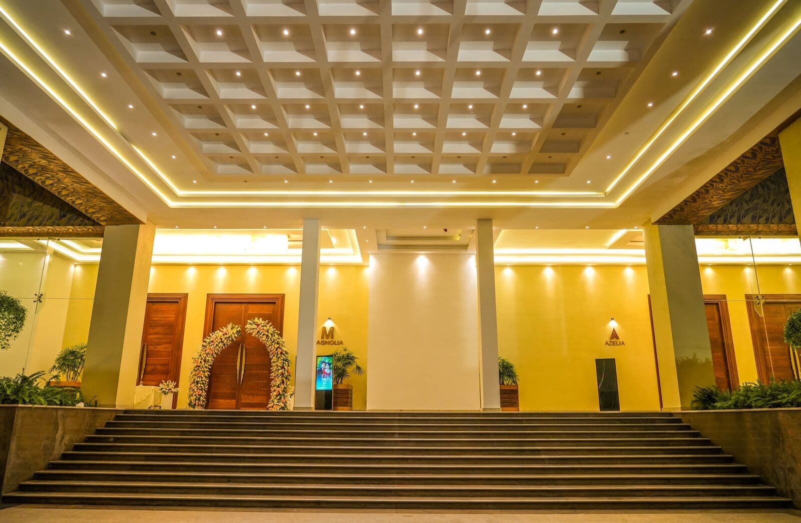The wide steps up to the hall entrance, lit in the evening