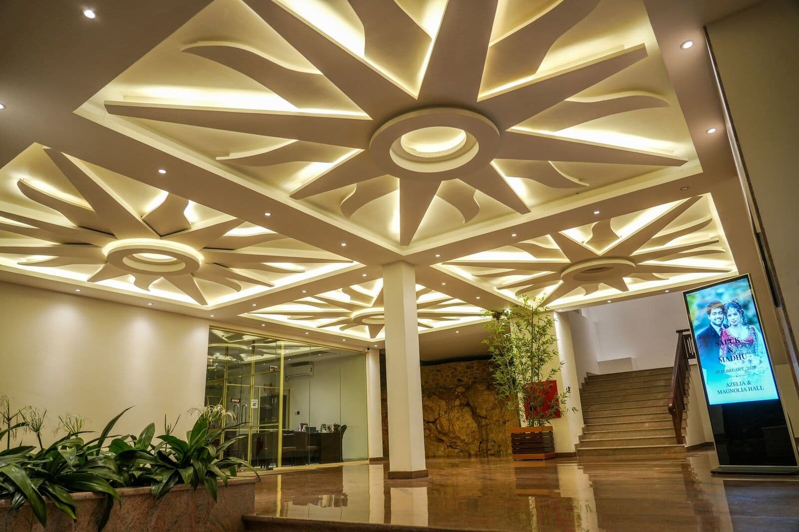 The lobby with its star-shaped ceiling and the staircase