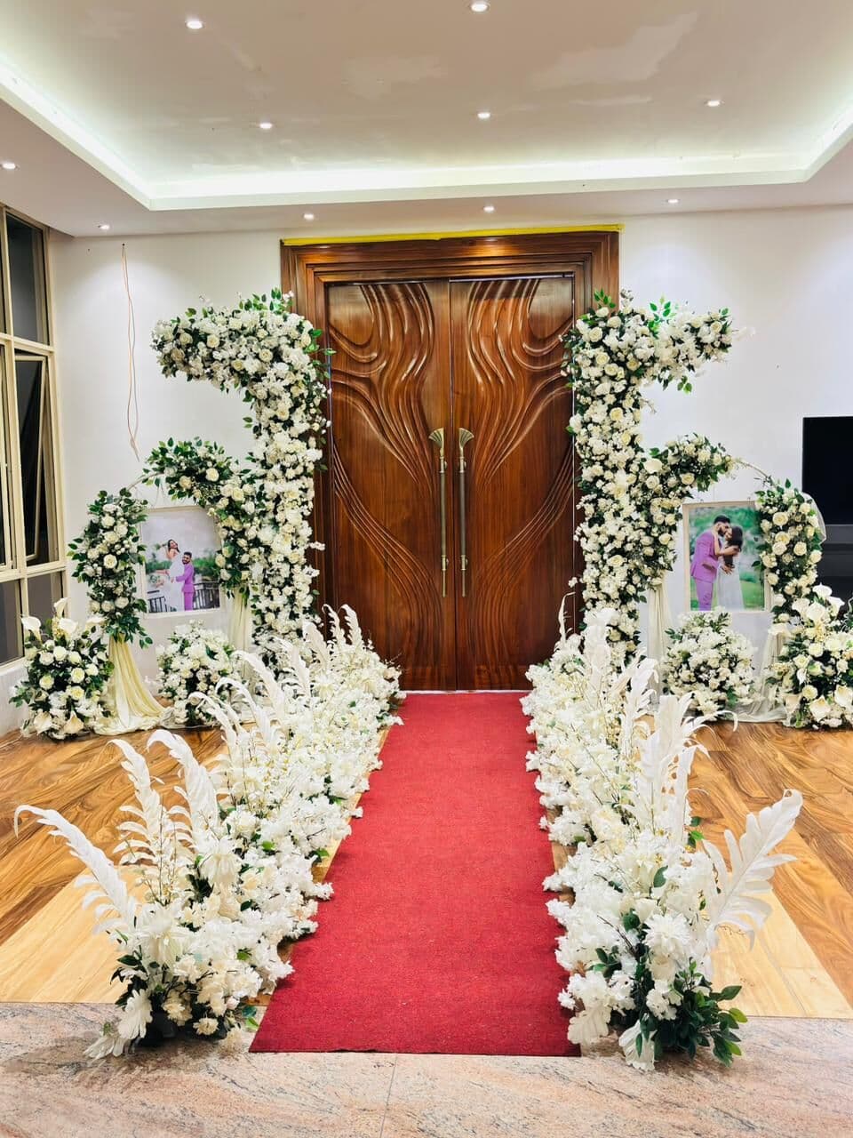 Wisteria's wooden doors framed with white flowers